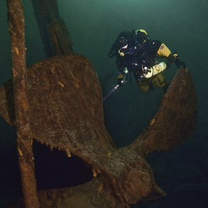 SRC Chief, Dave Conlin, on the prop of the Chisolm, Isle Royale, National Park